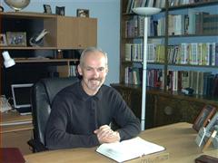 Pastor Marc Peterson at desk