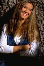 Photo of woman standing by tree